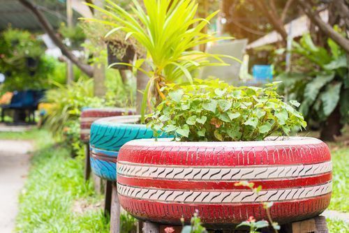 growing flowers herbs and vegetables.  tyre planters for the garden gardening 