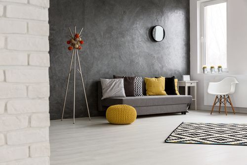 Image of a living room design with grey wall and marble flooring