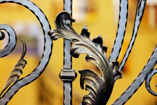 Image of a single iron leaf design on an iron door