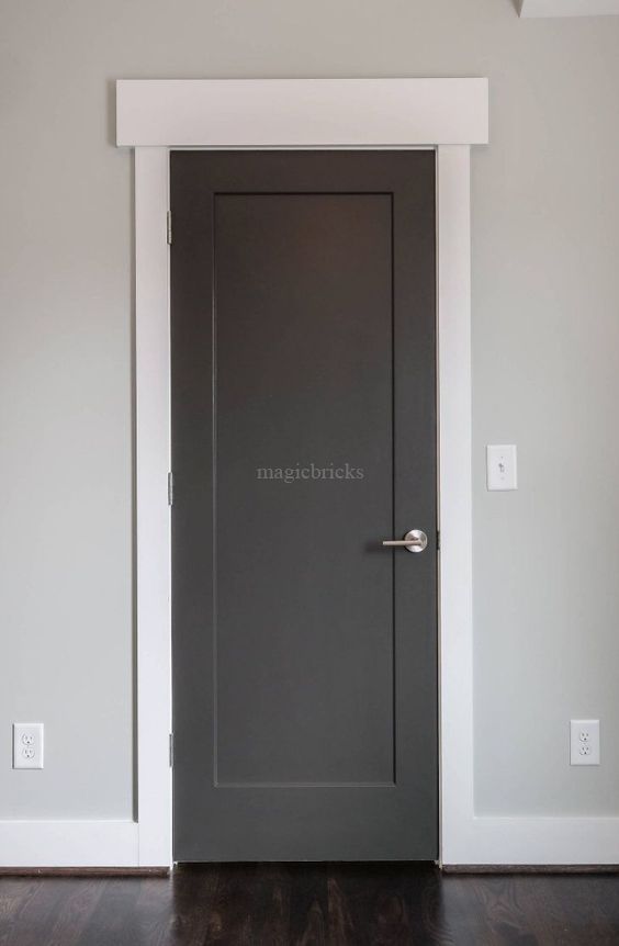 Grey room door with a silver handle