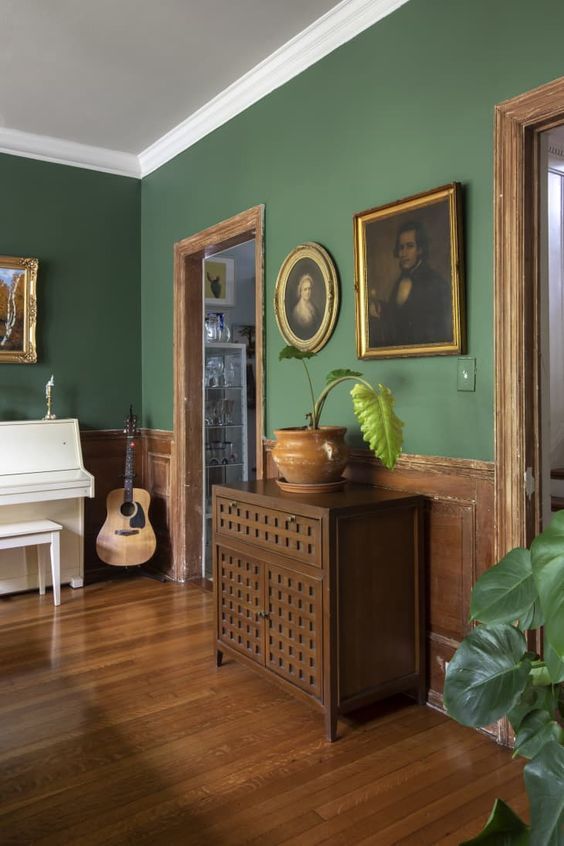Green walls and brown flooring make for a great home colour combination