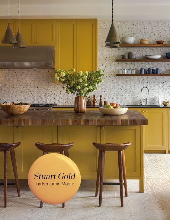 A modular kitchen in mustard yellow and white