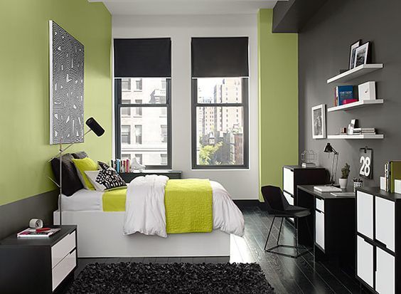A bedroom with a light green colour palette with grey and white
