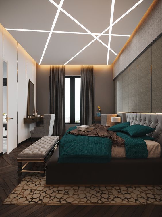 A bedroom with zig-zagging profile lights in false ceiling