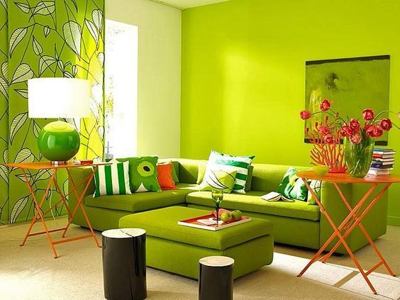 A living room with light green colour combination on walls and furniture