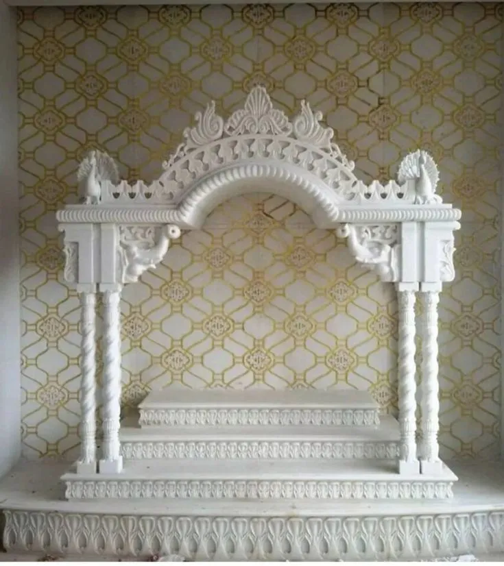 Marble stepped pooja room design