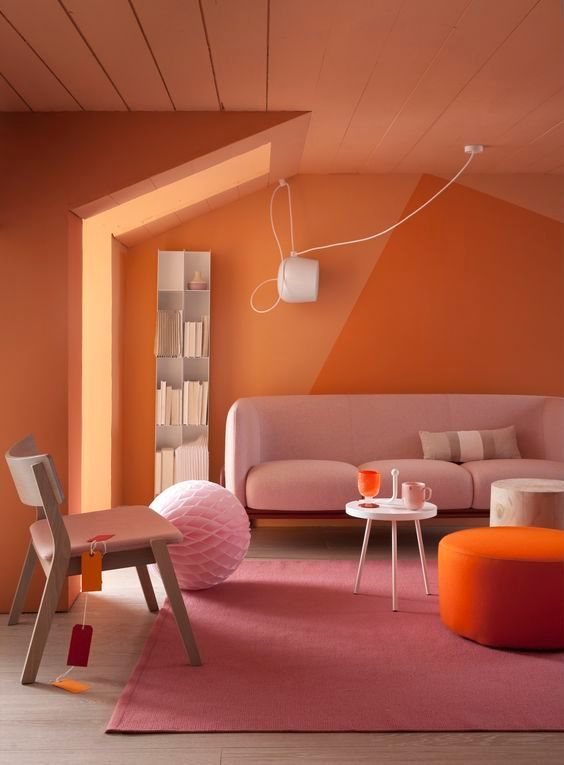 A striking hall done in the vibrant tangerine and pink colour scheme