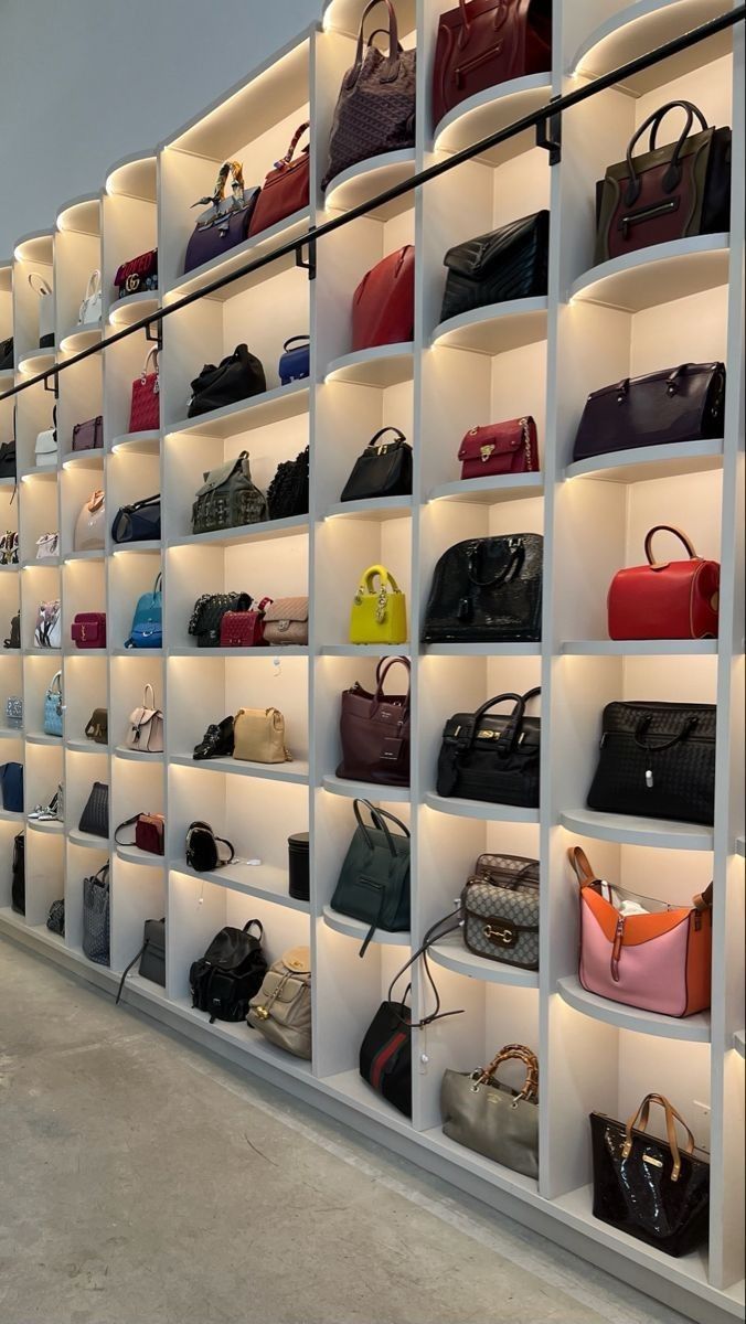 A dressing room wall with open shelves to display a great handbag collection