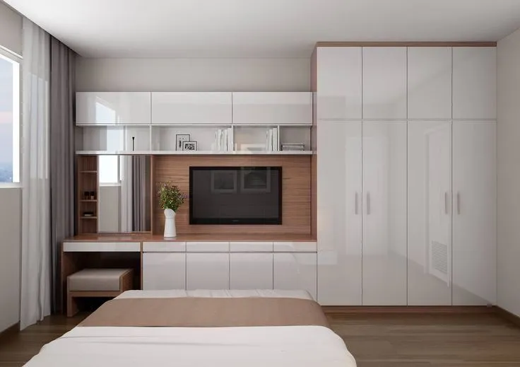 An elegant wall almirah design with space for a TV unit at its centre