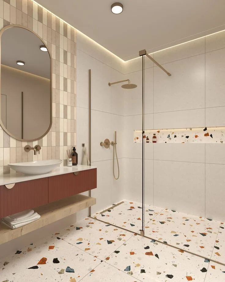 Large white terrazzo floor tiles with multi colored chips in a modern bathroom