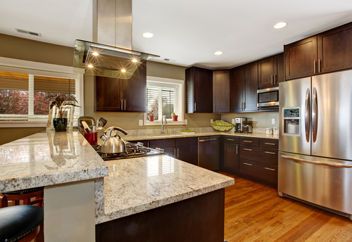 grey granite countertops with brown cabinets