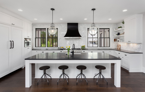 Black granite countertops with contrasting kitchen furniture