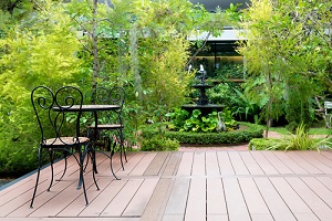 black-chair-wood-patio-green-garden