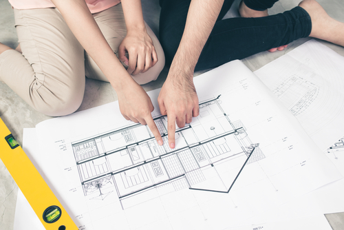 couple looking at house plans