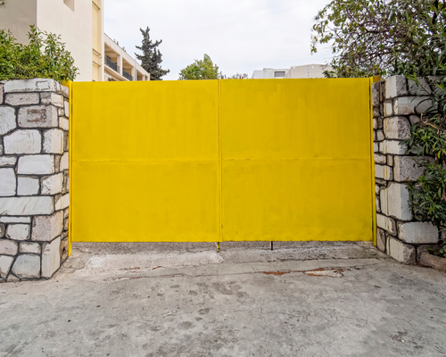 yellow-metal-double-door-gate