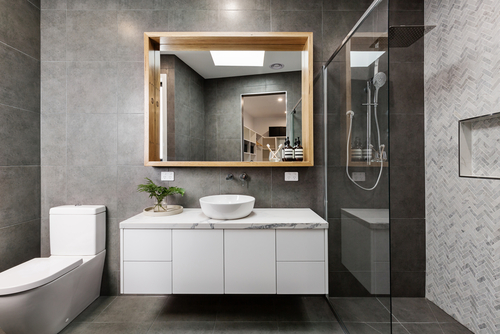 grey-tiles-with-and-a-wall-of-herringbone-marble
