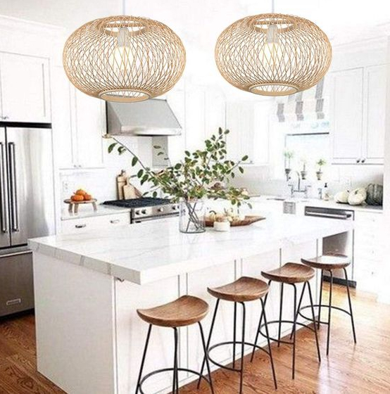 Spherical bamboo lights placed over a kitchen countertop