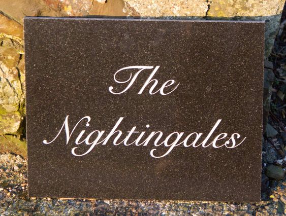 Granite name plate design in brown - perfect for a home