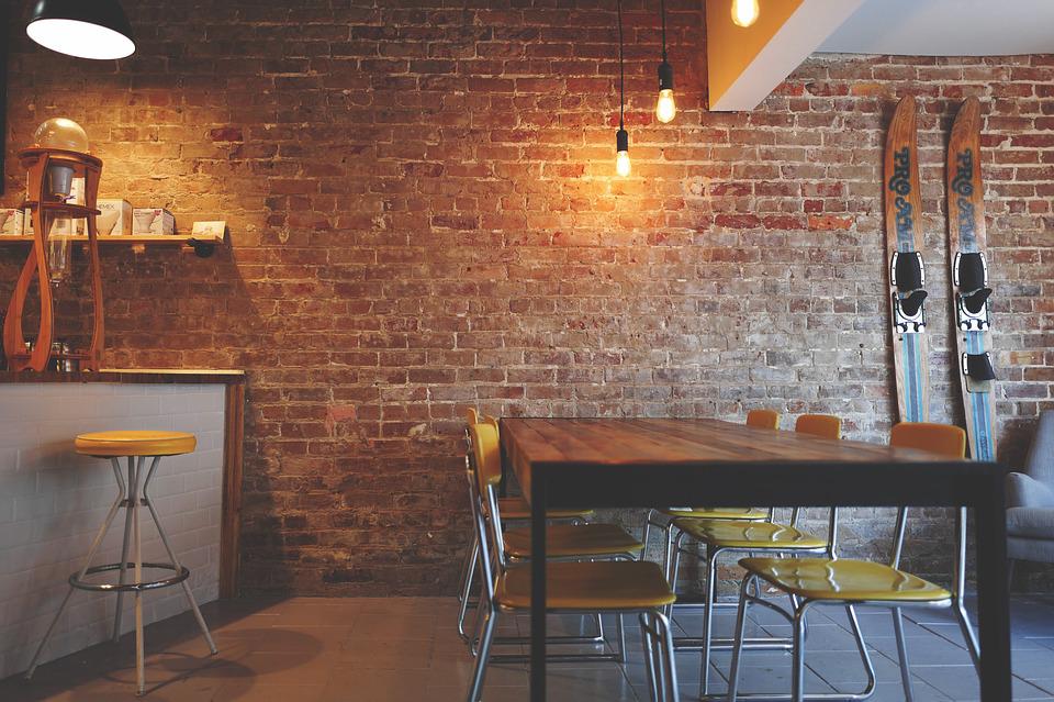 A rustic kitchen with brick wall design