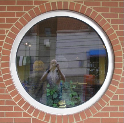 Round-UPVC-window-in-a-brick-wall