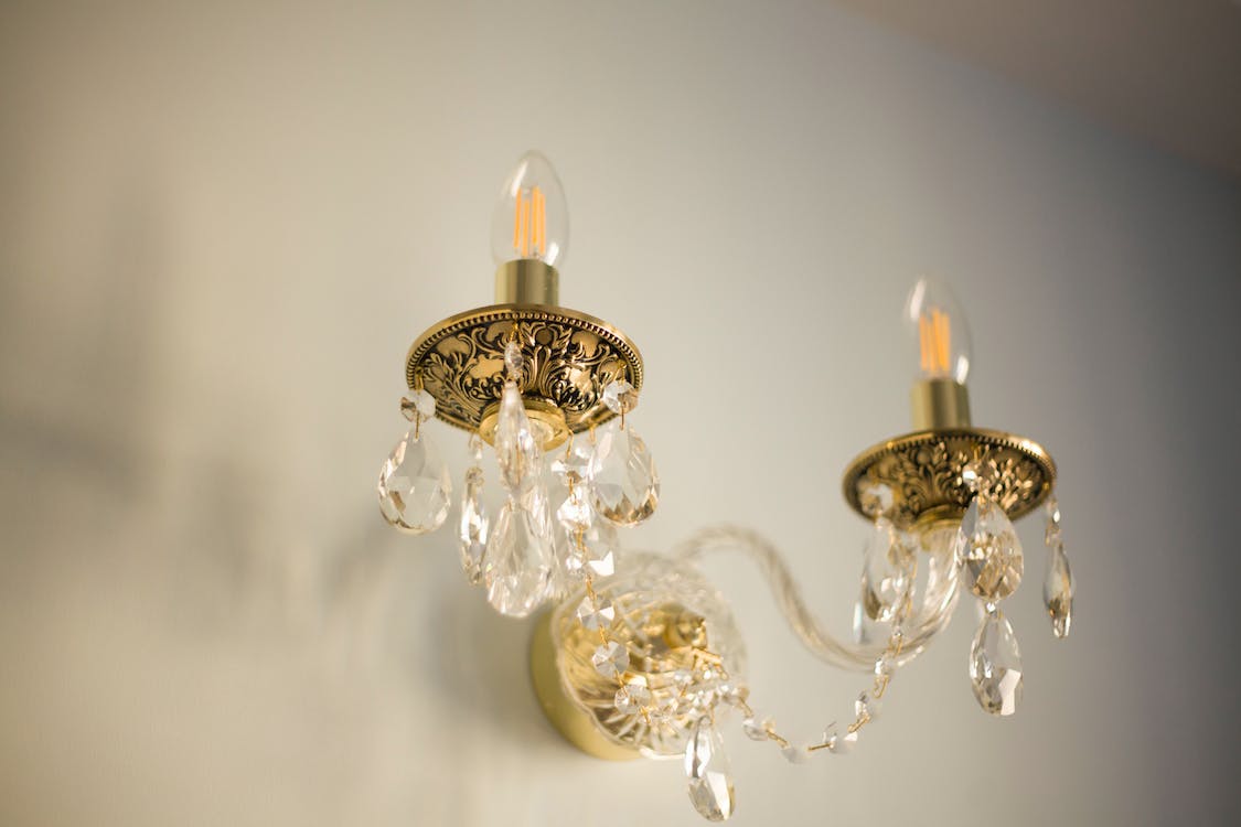 Crystal details on chandelier-style wall lights