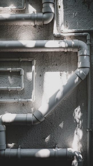 PVC pipes and fittings installed outside the house