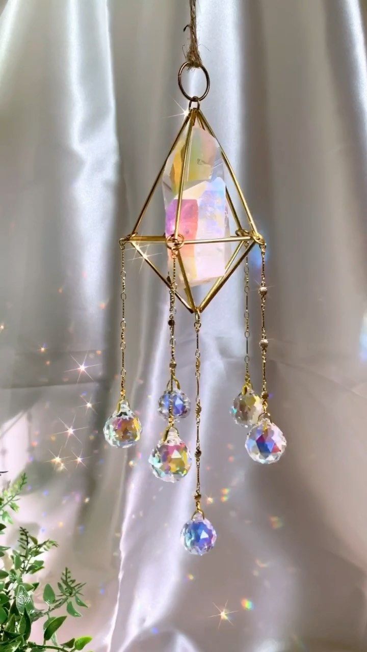 A crystal suncatcher brings tranquillity and adds beauty to yoga room decor