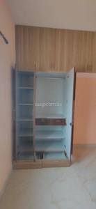 The closet has open doors and drawers at NJP Aksha Sai Green Park, Yelahanka, Bangalore