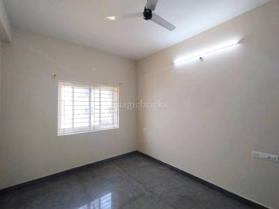 The room has a ceiling fan, window, and wall-mounted lights