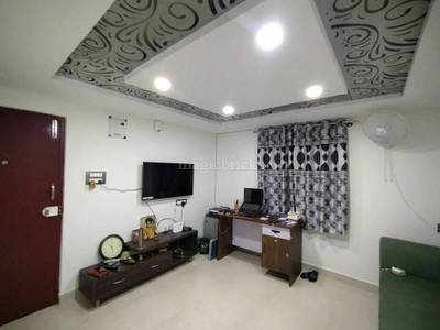 The living room contains furniture, curtains, and decorative items