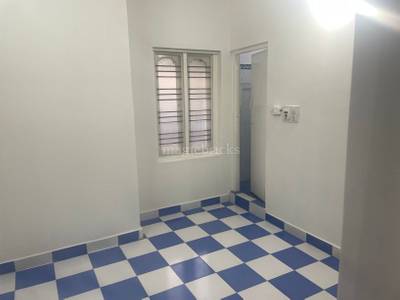 The room has a checkered floor, window, and door