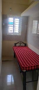 The bedroom has a bed, windows, and a tiled floor
